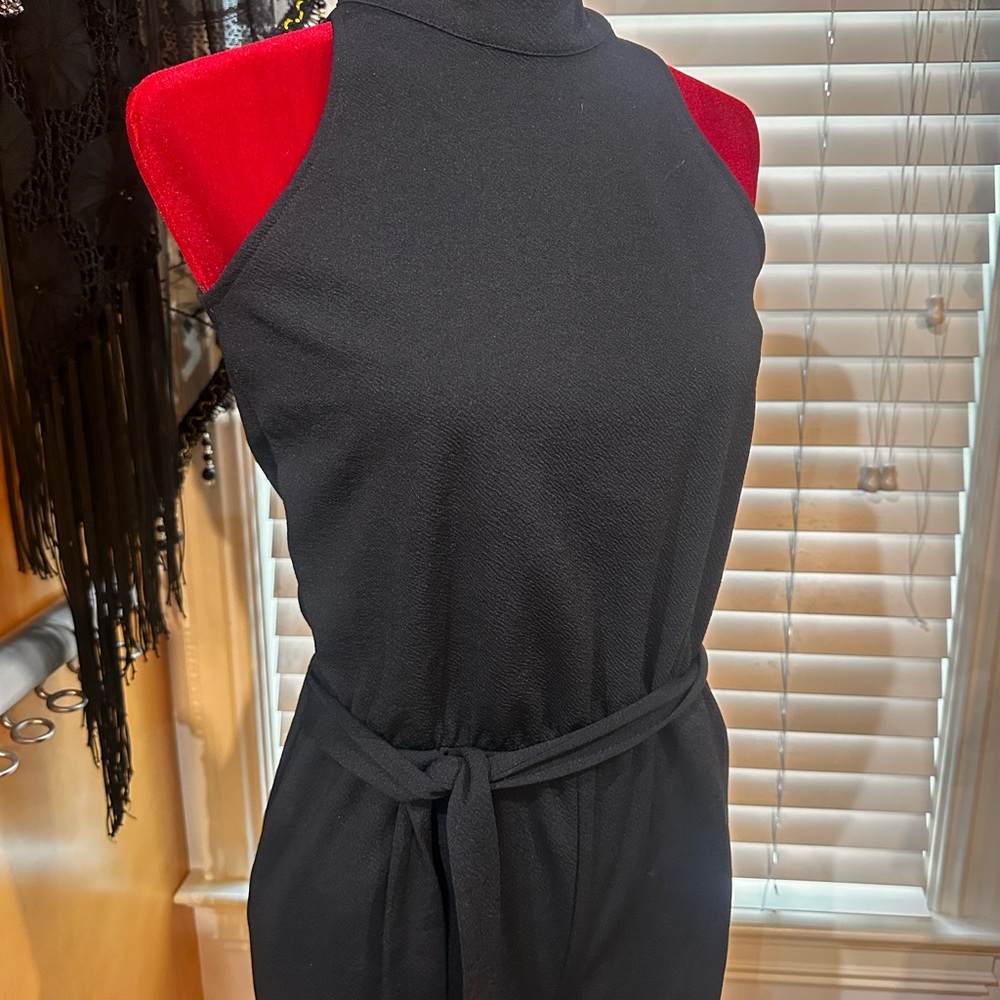 NWT Eye Candy Black Sleeveless Jumpsuit with halter style neck
Size M